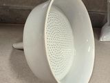 a close up of a white coffee cup on a counter
