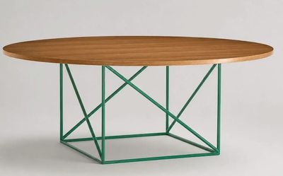 a round table with a wooden top and green metal base
