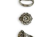 three rings and a ring with a flower on top of it