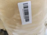 a label on the bottom of a vase that is sitting on a table
