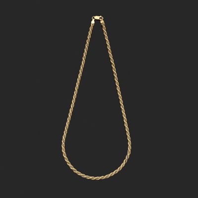 un collier à maillons dorés sur fond noir