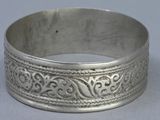 an image of a silver bracelet with a design on it