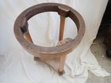 a wooden stool with a wooden seat on a white sheet