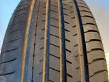 the tire of a car that is sitting on the side of the road