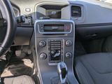 a dashboard of a car with a steering wheel and dashboard controls