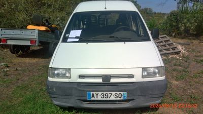 a white van that is parked in the grass