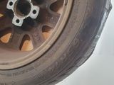 a close up of a tire on a white surface