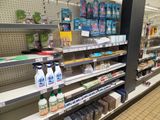 many shelves in the store that have various products on them