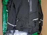 a cardboard box with a black jacket inside of it