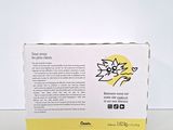 a white box with yellow writing on it sitting on a table
