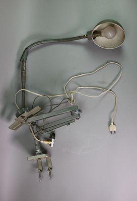a light that is attached to a lamp that is on the wall
