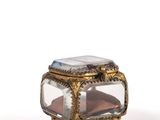 a small glass box with a glass top on a table