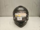 the helmet is black and has a sticker on it