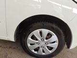 a close up of a white car with a flat tire