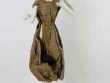 an image of a mannequin dressed in a brown and black checkered dress
