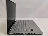 an open laptop computer sitting on top of a white table