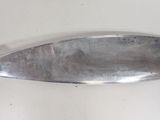 a silver spoon on a white surface with a silver handle