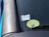 a sticker on the windshield of a car with a sticker on it