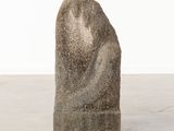 concrete sculpture of a woman ' s head on a block of concrete