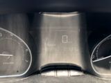 a close up of a car dashboard with a speedometer and gauges