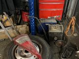 a tire that is sitting on the ground in a garage