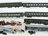 several toy trains are lined up on a white surface