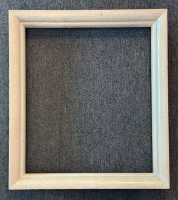 an empty wooden frame on a gray background