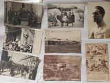 many old photographs of men and women on the table