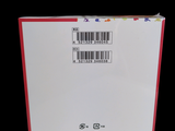 a box with a barcode on it on a black background