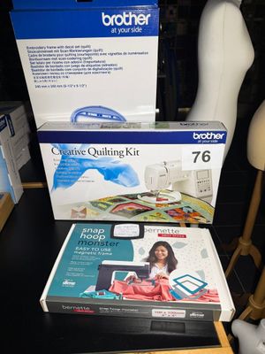 two boxes of brother quilting kits on a table