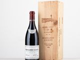 a bottle of wine next to a wooden box