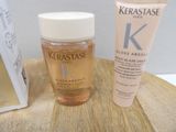 a bottle of kerastase and a tube of kerastase oil on a table