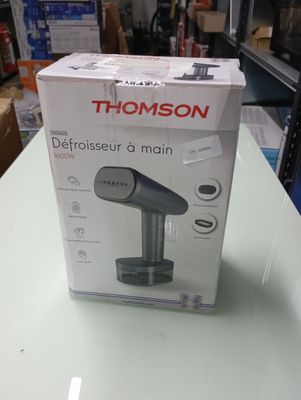 packaging of a black and white portable hair dryer sitting on top of a table
