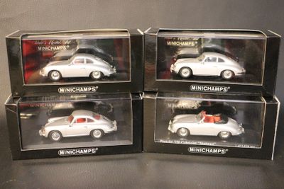 three boxed boxed white porsches in boxes on a table