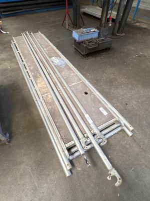 a long metal bench in the middle of a building