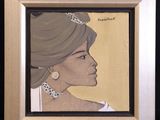 painting of a woman with a turban and earrings in a wooden frame
