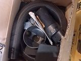a box with a blow dryer and other items inside of it