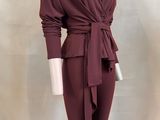a picture of a mannequin wearing a maroon top and pants