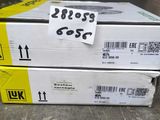 two boxes of yellow and black ink are stacked on top of each other