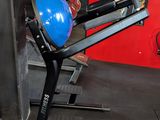 a gym room with a blue ball on a machine