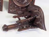 a wooden clock that is sitting on a table