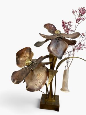 a vase with flowers in it and a vase with flowers in it