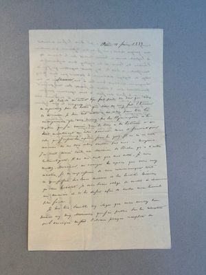 a piece of paper with writing on it sitting on top of a table