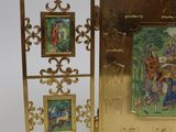 a gold frame with a picture of a man and a woman on it