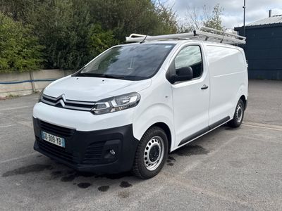 a white van that is parked in a parking lot