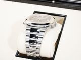 a watch that is sitting on top of a watch stand