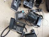 a lot of phones that are sitting on the floor