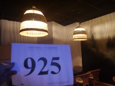 a person holding up a sign in a restaurant