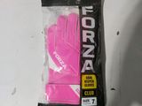 a pink glove that is in a bag on a table