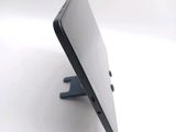 a close up of a cell phone on a stand